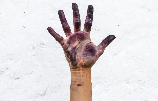 Ink covered hand